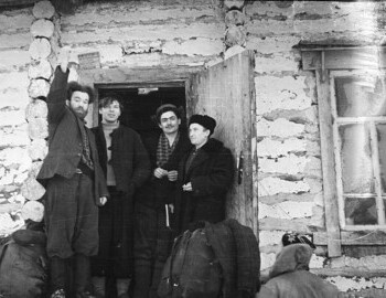 Jan 27 - District 41. Preparing to leave. Standing on the porch: Ognev-?-?-Venediktov? (with the book). Dyatlov with his back. 